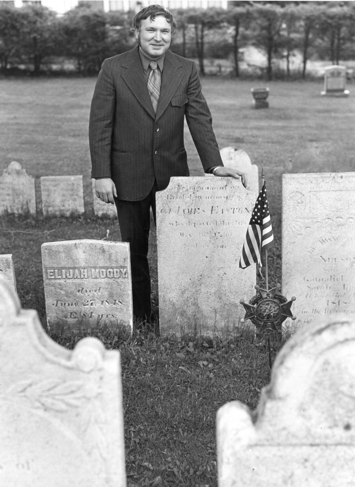 Stephen D. Budrow, local cemetery historian, stans at the grave of Col. James Easton, who helped plan the capture of Fort Ticonderoga and who had a store and tavern in Pittsfield.